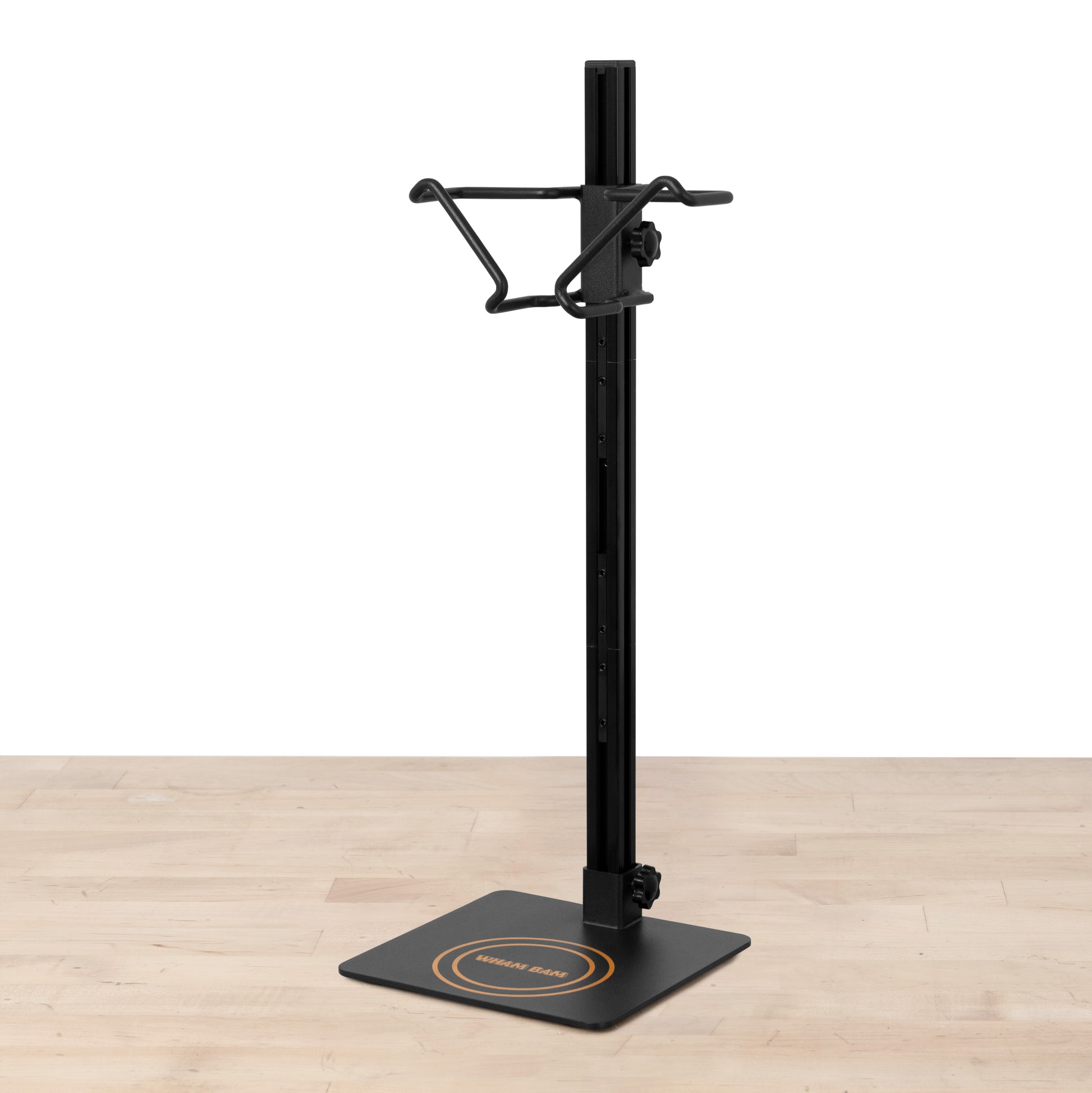 A black ULTIM8 DRIP table version tool for draining and filtering resin, consisting of a wire vat hanger assembly, mounted on a steel base with felt feet.